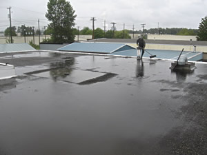 Tar and gravel roof leak - Crucial Roof Services